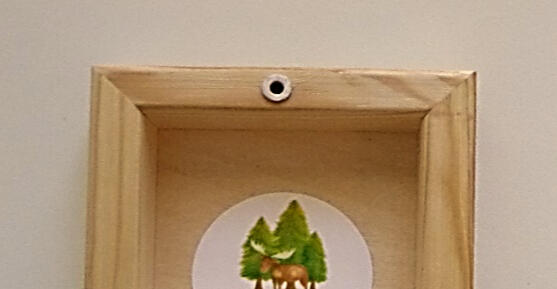 Wood panels have a drilled opening for hanging flush to the wall.